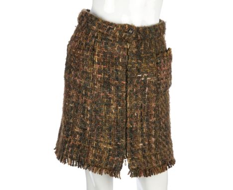 Chanel, a wool skirt, featuring a full-length front zip closure, CC button detail and two front patch pockets, labelled Chane