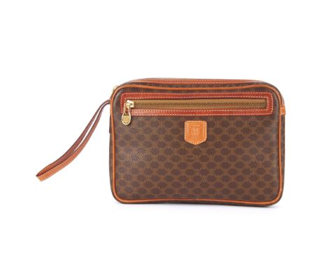 Celine, a vintage macadam wristlet clutch, featuring maker's brown monogram coasted canvas exterior with tan leather trim, fr