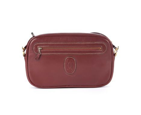 Cartier, a vintage Bordeaux leather camera bag, crafted from smooth burgundy leather, featuring maker's logo emblem to the ce