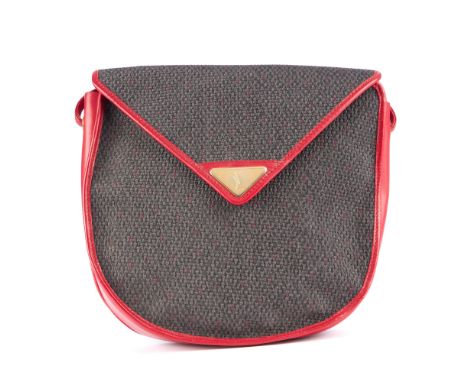 Yves Saint Laurent, a vintage handbag, designed with a coated woven canvas exterior and red leather trim, long then leather s
