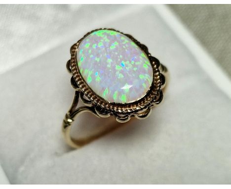 9ct Gold &amp; Opal Dress Ring,  set with single opal (measures 14x10mm approx). Size R and weighs 2.6g approx