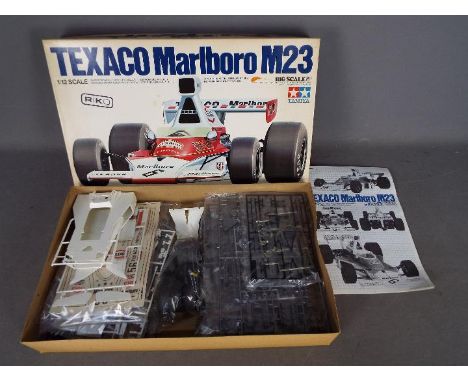 Tamiya - A vintage boxed Tamiya BS1216  Texaco Marlboro McLaren M23 1:12 'Big Scale' plastic model kit. The kit appears to be