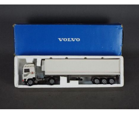 Conrad - A boxed 1:50 scale diecast Volvo F10 Fridge Trailer. The model appears to be in Excellent condition some pitting to 