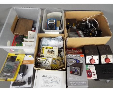 Model Railways - four boxes of OO gauge accessories to include transformers, control units, wiring kits with lighting for sig