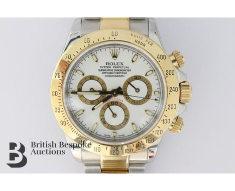 Gentleman's Rolex Daytona Oyster Perpetual chronometer. The watch having a white face with gold batons and gold and white gol