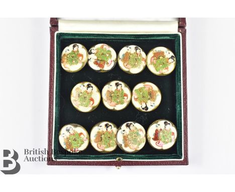 Eleven Japanese porcelain buttons, approx 22 mm in diameter, each button painted with geisha in the Satsuma style, circa 1900