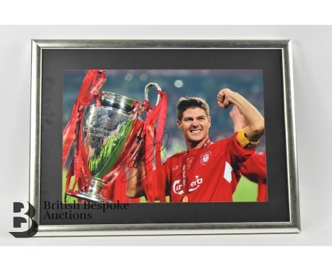 Two signed Liverpool photographs; one signed photograph of Steven Gerrard holding the trophy for the 2005 Eufa European Champ