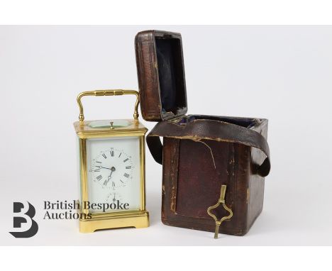 19th century gilt brass carriage clock, 8 day movement, repeater, white enamel face with roman dial and alarm, complete with 