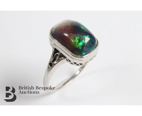 Stunning 3.08ct black opal ring, size M, approx 2.9 gms. The opal measures 12 x 8mm.