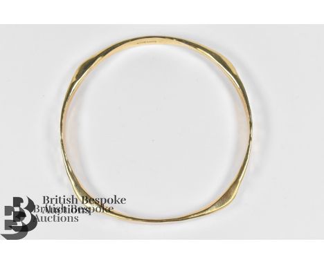 Lady's 9ct gold bangle, approx 24.59 gms, stamped 975, mm W J Ltd.&nbsp;