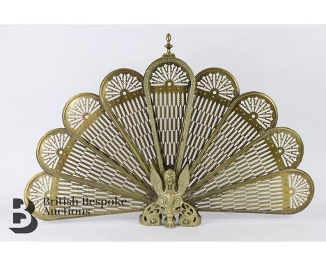Highly decorative 20th century peacock-motif brass firescreen, conveniently folds away when not in use.