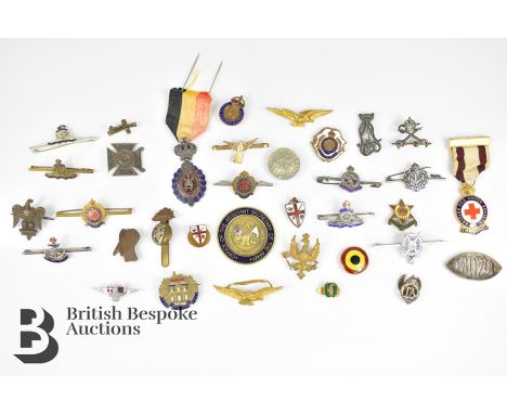 Thirty six cap badges and buttons including Royal Dragoons, Royal Army PT Corp, Assistant Secretary of the Army Challenge coi