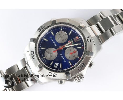 Gentleman's Tag Heuer Quartz Aquaracer wrist watch. The watch having a blue face with silver subsidiary dials and rotating be