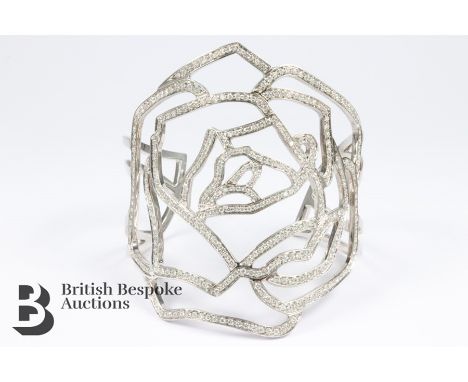 Gavello 18ct white gold and diamond bangle. The bangle set with 4.5 cts of pave-set dias, 56.9 gms, beautifully crafted open 