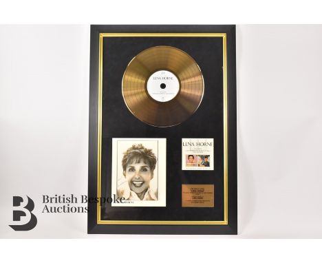 A framed signed photograph of Lena Horne and gold disc of 'It's Love' performed by Lena Horne and Van Heusen. Certificate of 