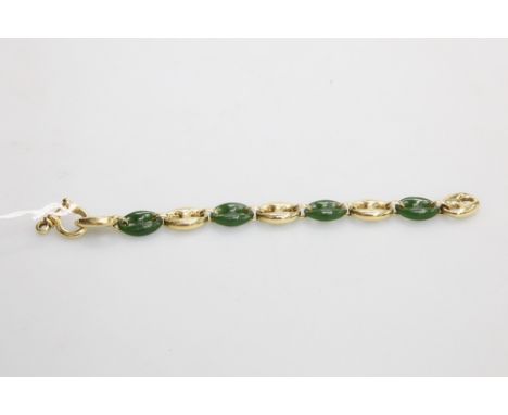A substantial 18ct gold and jade bracelet, of pierced alternating oval links, stamped 750. 