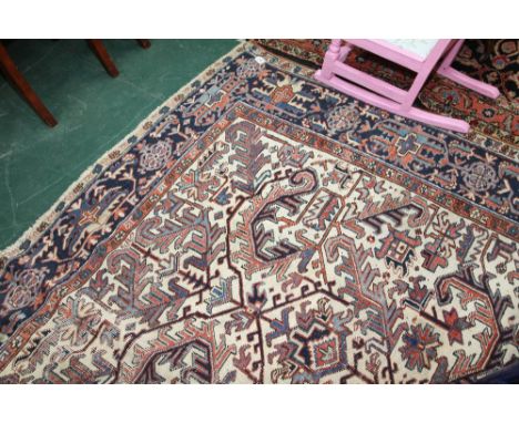 An antique Persian Heriz carpet. 2.79m x 1.90m