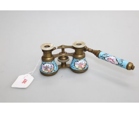 A pair of French enamel opera glasses, with mother of pearl rims to the eye pieces,  the handle and binoculars decorated with