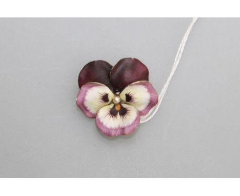 A 14ct gold and enamel pansy brooch, the very naturalistically modelled and coloured flowerhead centred by a seed pearl, moun