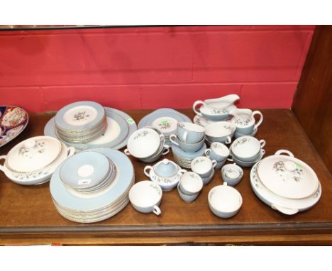 A Royal Doulton 'Rose Elegance' dinner service comprising ten dinner plates, eleven dessert plates, six side plates, six tea 