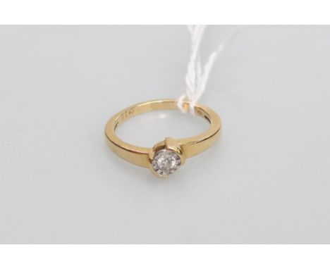 A solitaire diamond ring on 18ct gold mount