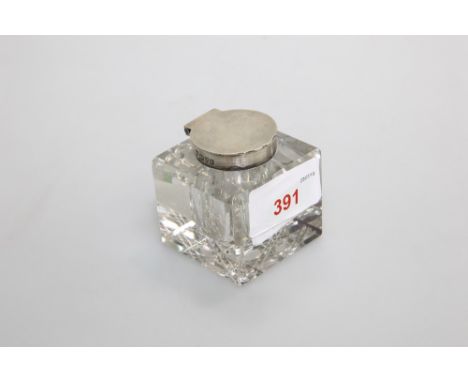 A silver mounted cut glass inkwell of square shape, Chester 1904, 5.5cm high by 5cm square 