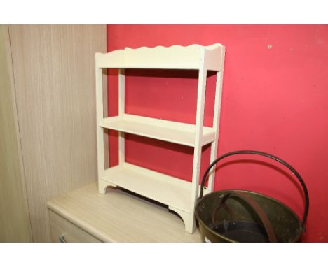 A painted three tier hanging shelf