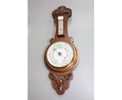An oak cased barometer