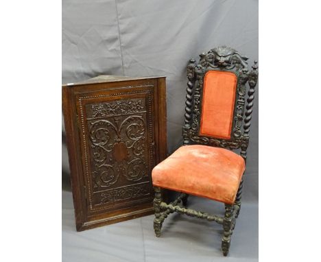 A VINTAGE CARVED OAK WALL HANGING CORNER CUPBOARD and a high backed barley twist hall chair with mask crest detail, 91cms hei