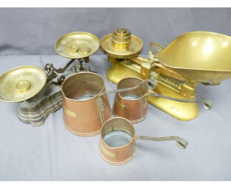 A GRADUATED TRIO OF VINTAGE COPPER, cider measures and two sets of old scales