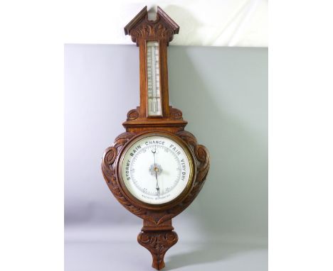 AN OAK FRAMED VINTAGE ANEROID BAROMETER WITH THERMOMETER, 84cms length