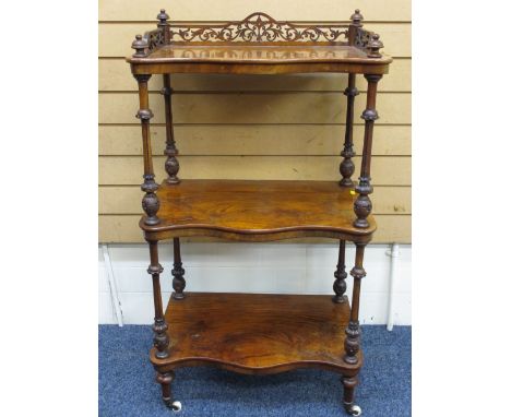 A FINE WALNUT THREE SHELF ANTIQUE WHATNOT with carved galleried top, galleried rail