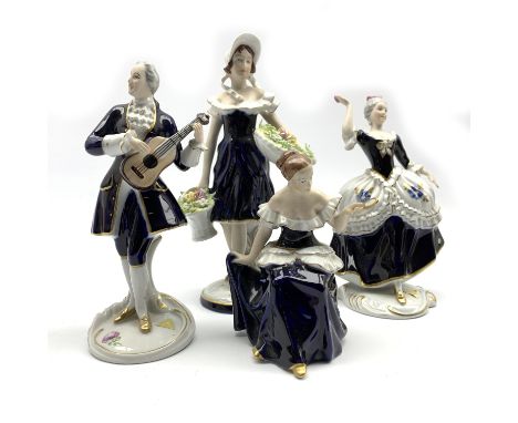 Royal Dux figure of a girl with flower baskets H26cm, another figure playing the guitar H23cm and two other Royal Dux figures