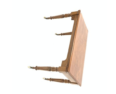19th century walnut library side table, the associated moulded top raised on turned fluted supports terminating in ceramic ca