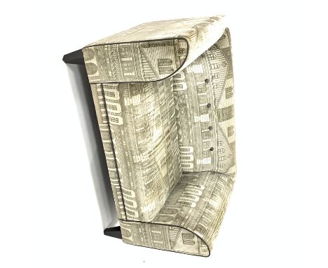 DFS snuggle chair, upholstered fabric with architectural pattern, ebonised tapering supports, W136cm Condition Report & Furth