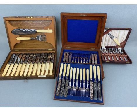 Three cased sets of antique / vintage electroplate cutlery comprising a Victorian mahogany canteen of twelve dessert / fruit 