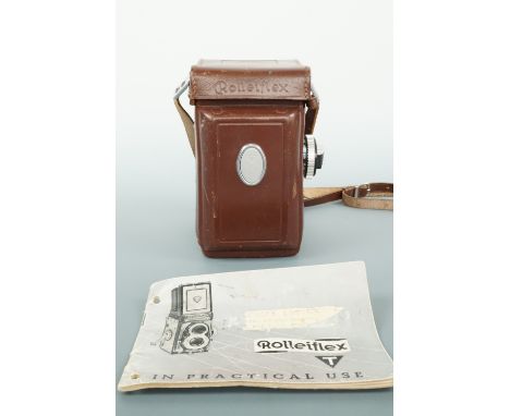 A Rollieflex T camera and handbook