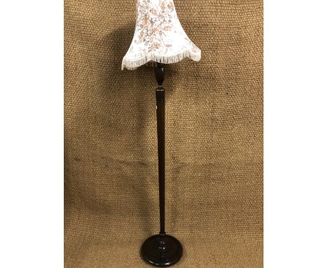 A 1930s - 1940s oak standard lamp