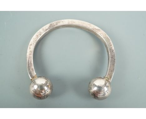 A child's silver torc bangle, approx 4 cm