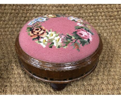 A Victorian inlaid mahogany pad stool with floral wreath tapestry top