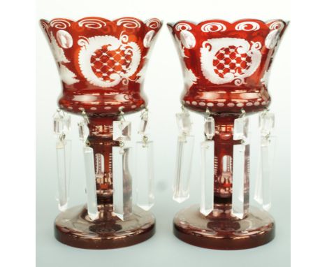 A pair of Victorian ruby-flashed and wheel cut lustres with prismatic drops, 21 cm