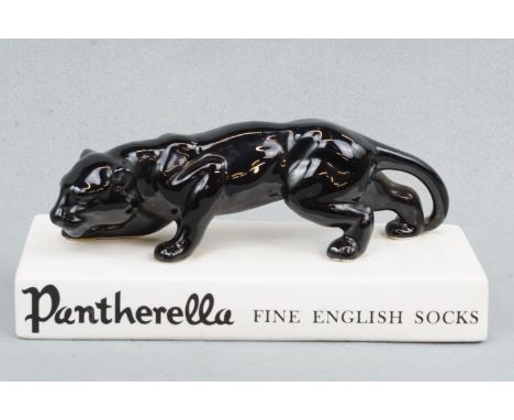 A vintage "Pantherella Fine English Socks" shop display ceramic advertising panther figurine