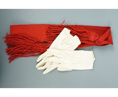 A British army sergeant's scarlet sash together with a pair of kid leather gloves
