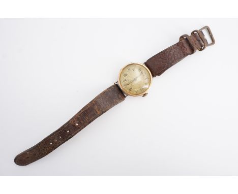 A 1920s Unicorn 9 ct gold wrist watch, having a 15 jewel manual movement, the circular frosted face having luminous Arabic nu