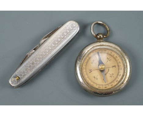 An early 20th Century German pocket magnetic compass together with a folding knife, compass 3.5 cm