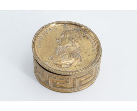 A 19th Century brass drum form box celebrating Admiral Lord Nelson (1758-1805), the cover bearing a bas-relief profile portra