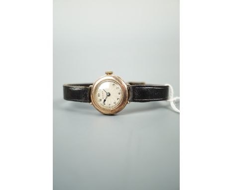 A 1920s lady's Rolex 9 ct gold wristlet watch, having a "Standard Quality" 15-jewel movement and circular engine-turned rose 