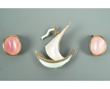 A pair of Norwegian enamelled white metal clip earrings, each of concave oval form, pink basse taille enamelled over a radial
