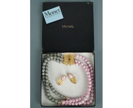 A 1980s Monet belt / bracelet and statement earrings suite, comprising a multi-strand marbled bead waist belt intended to be 