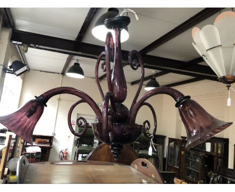 A flamboyant three-branch amethyst glass chandelier, 54 cm
